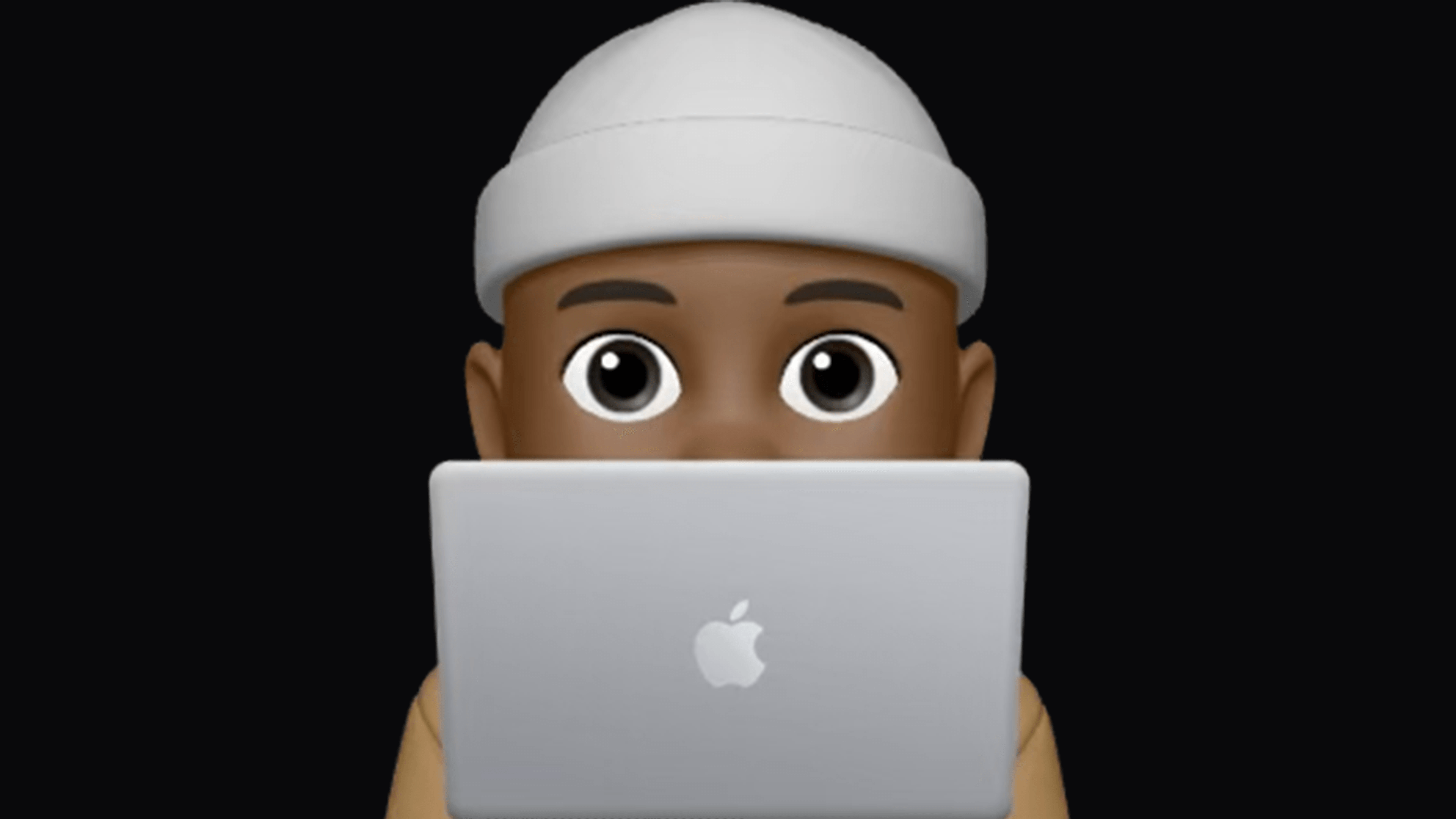 Apple memoji behind laptop